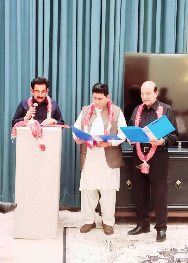 The Chairman administering the oath of office to the Association office bearers